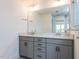 Modern bathroom featuring a double vanity, large mirrors, and stylish lighting fixtures at 14 Relaxing Way, Pittsboro, NC 27312