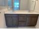 Bathroom vanity features double sinks, grey cabinets, quartz counters, and modern fixtures at 14 Relaxing Way, Pittsboro, NC 27312