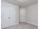 Bedroom featuring soft carpet, bright windows, and closet space at 14 Relaxing Way, Pittsboro, NC 27312