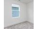Bright bedroom features a large window, neutral carpet, and crisp white trim at 14 Relaxing Way, Pittsboro, NC 27312