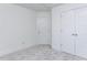A bedroom with neutral carpet, and two doors including a closet at 14 Relaxing Way, Pittsboro, NC 27312