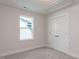 Bedroom features a bright window, soft carpet, and a closet for storage at 14 Relaxing Way, Pittsboro, NC 27312