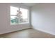 Bright, empty bedroom with a large window offering scenic views and hardwood floors at 14 Relaxing Way, Pittsboro, NC 27312