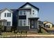 Modern home exterior with gray siding, black accents, and freshly planted landscaping at 14 Relaxing Way, Pittsboro, NC 27312