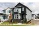 Stylish two-story home with contrasting black and gray siding, set in a beautifully landscaped community at 14 Relaxing Way, Pittsboro, NC 27312