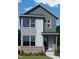 Charming two-story home with a stylish gray exterior, a brick foundation, and a welcoming front porch at 14 Relaxing Way, Pittsboro, NC 27312