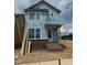 View of unfinished home featuring brick and large windows at 14 Relaxing Way, Pittsboro, NC 27312
