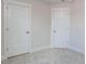 Image showcases two white paneled doors in a room with light neutral walls and plush carpeting at 14 Relaxing Way, Pittsboro, NC 27312