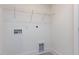 A functional laundry room with shelving and clearly marked hookups at 14 Relaxing Way, Pittsboro, NC 27312