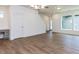 Open living room featuring hardwood floors, modern lighting, and neutral walls at 14 Relaxing Way, Pittsboro, NC 27312