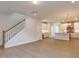 Wide angle of main floor with stairs, fireplace, kitchen, and built-in desk area at 14 Relaxing Way, Pittsboro, NC 27312