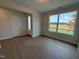 Bright living room featuring light wood floors, white walls, and a window with a view of the outdoors at 14 Relaxing Way, Pittsboro, NC 27312