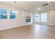 Sunlit living room features hardwood floors, a modern fireplace, recessed lighting, and large windows at 14 Relaxing Way, Pittsboro, NC 27312