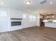 Open concept floor plan with fireplace and view of modern kitchen at 14 Relaxing Way, Pittsboro, NC 27312