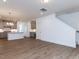 Open-concept living and kitchen area with recessed lighting and modern finishes at 14 Relaxing Way, Pittsboro, NC 27312