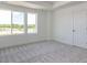 Bright bedroom featuring plush carpeting, a large window, and neutral walls at 14 Relaxing Way, Pittsboro, NC 27312
