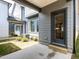 Patio view between two homes with doorways and windows, showcasing the outdoor space and home design at 14 Relaxing Way, Pittsboro, NC 27312