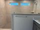 Modern bathroom features a tile shower with glass enclosure and tiled floors at 14 Relaxing Way, Pittsboro, NC 27312