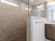 Newly tiled walk-in shower with glass partition and built-in showerhead at 14 Relaxing Way, Pittsboro, NC 27312