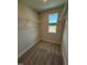 Walk-in closet featuring carpet and wire shelving for organized storage and natural light from 2 windows at 14 Relaxing Way, Pittsboro, NC 27312