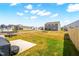 Spacious backyard with a trampoline and grassy area, perfect for outdoor enjoyment at 1427 Carisbrooke Dr, Mebane, NC 27302