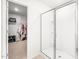 Bathroom showcasing a modern glass door shower and a glimpse into the walk-in closet at 1427 Carisbrooke Dr, Mebane, NC 27302
