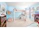 Vibrant bedroom with a loft bed, study area, and colorful decor, creating a playful atmosphere at 1427 Carisbrooke Dr, Mebane, NC 27302