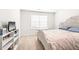 Bright bedroom with a wicker bed frame, neutral walls, and a cozy, inviting atmosphere at 1427 Carisbrooke Dr, Mebane, NC 27302