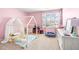 Cozy bedroom with playful decor, charming furnishings, and a bright, cheerful ambiance at 1427 Carisbrooke Dr, Mebane, NC 27302