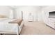 Spacious bedroom featuring high ceilings, plush carpet, and multiple dressers for ample storage at 1427 Carisbrooke Dr, Mebane, NC 27302