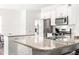 Bright kitchen features granite countertops, stainless steel appliances, and white cabinets at 1427 Carisbrooke Dr, Mebane, NC 27302