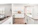 Bright kitchen features granite countertops, stainless steel appliances, and open layout at 1427 Carisbrooke Dr, Mebane, NC 27302