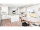 Bright eat-in kitchen features granite counters, stainless appliances, and access to the yard at 1427 Carisbrooke Dr, Mebane, NC 27302