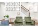 Charming living room featuring a staircase and stylish decor at 1427 Carisbrooke Dr, Mebane, NC 27302
