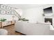 Bright living room with a fireplace, staircase, and a cozy seating area at 1427 Carisbrooke Dr, Mebane, NC 27302