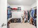 Spacious walk-in closet with ample shelving, clothing racks, and room for shoe storage at 1427 Carisbrooke Dr, Mebane, NC 27302