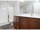 Modern bathroom with double sinks, ample counter space, and a sleek glass-enclosed shower at 14315 Foxcroft Rd, Raleigh, NC 27614