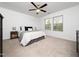 Serene bedroom with a king bed, reading nooks, and natural light from two windows at 14315 Foxcroft Rd, Raleigh, NC 27614