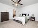Comfortable main bedroom featuring a king bed, dresser, and nightstands with reading lamps at 14315 Foxcroft Rd, Raleigh, NC 27614