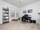 Sunlit office space featuring neutral carpet, a modern desk setup, and ample natural light through large windows at 14315 Foxcroft Rd, Raleigh, NC 27614