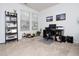 Inviting office area with neutral carpet, a modern desk, shelving, and well-lit with natural light at 14315 Foxcroft Rd, Raleigh, NC 27614