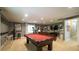 Finished basement featuring a pool table, bar area, and entertainment space at 1505 Sharnbrook Ct, Raleigh, NC 27614