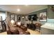Basement featuring a brown leather couch, TV, posters, and a treadmill at 1505 Sharnbrook Ct, Raleigh, NC 27614