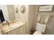 Bathroom with granite countertop, framed mirror and 'Choose Happy' sign for a warm, inviting feeling at 1505 Sharnbrook Ct, Raleigh, NC 27614