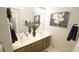 Bathroom featuring double sink vanity, framed mirror, and tile floors at 1505 Sharnbrook Ct, Raleigh, NC 27614