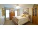 Cozy bedroom featuring a wooden bed frame, lots of sunlight, and neutral walls at 1505 Sharnbrook Ct, Raleigh, NC 27614