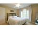 Bedroom featuring neutral walls, lots of sunlight, ceiling fan, and carpet floors at 1505 Sharnbrook Ct, Raleigh, NC 27614