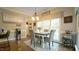 Cozy dining area featuring a table with seating and a large window with natural light at 1505 Sharnbrook Ct, Raleigh, NC 27614