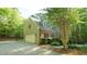 Exterior view of a well-maintained house with attached garage, lush landscaping, and a paved driveway at 1505 Sharnbrook Ct, Raleigh, NC 27614