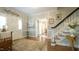 Elegant foyer with hardwood floors, staircase, and decorative touches offering a warm ambiance at 1505 Sharnbrook Ct, Raleigh, NC 27614